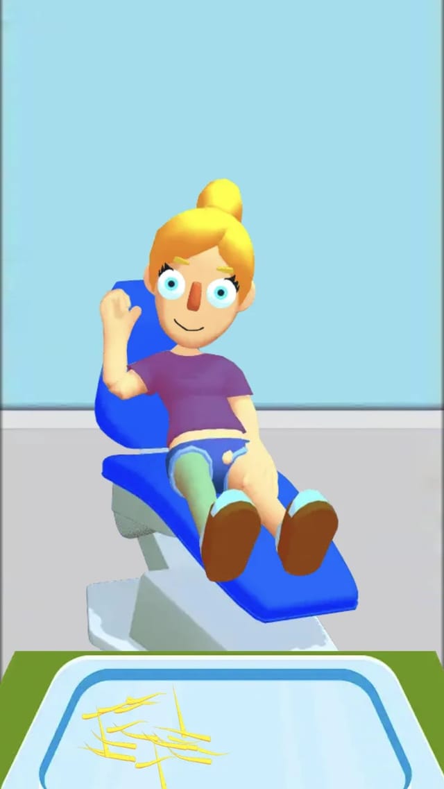 Ear Clinic patient smiling in the clinic chair after treatment, trimmed ear hairs collected on the medical tray