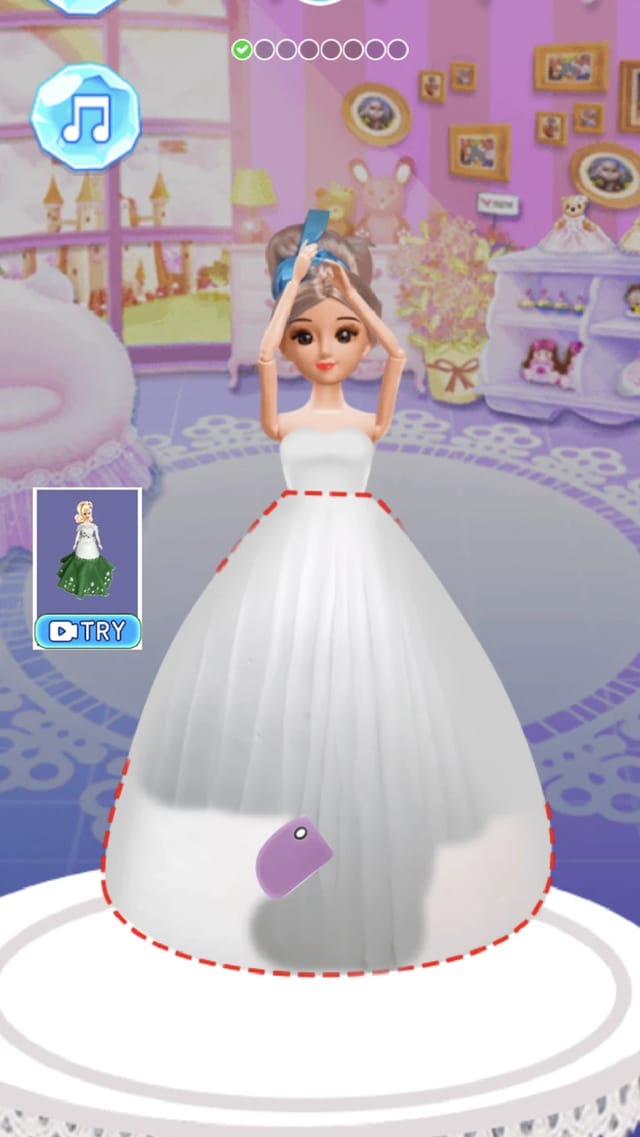 Icing On Doll Cake decorating step with a doll wearing a piped white icing gown, a purple spatula on the skirt, a red dashed guide outline and the step dots