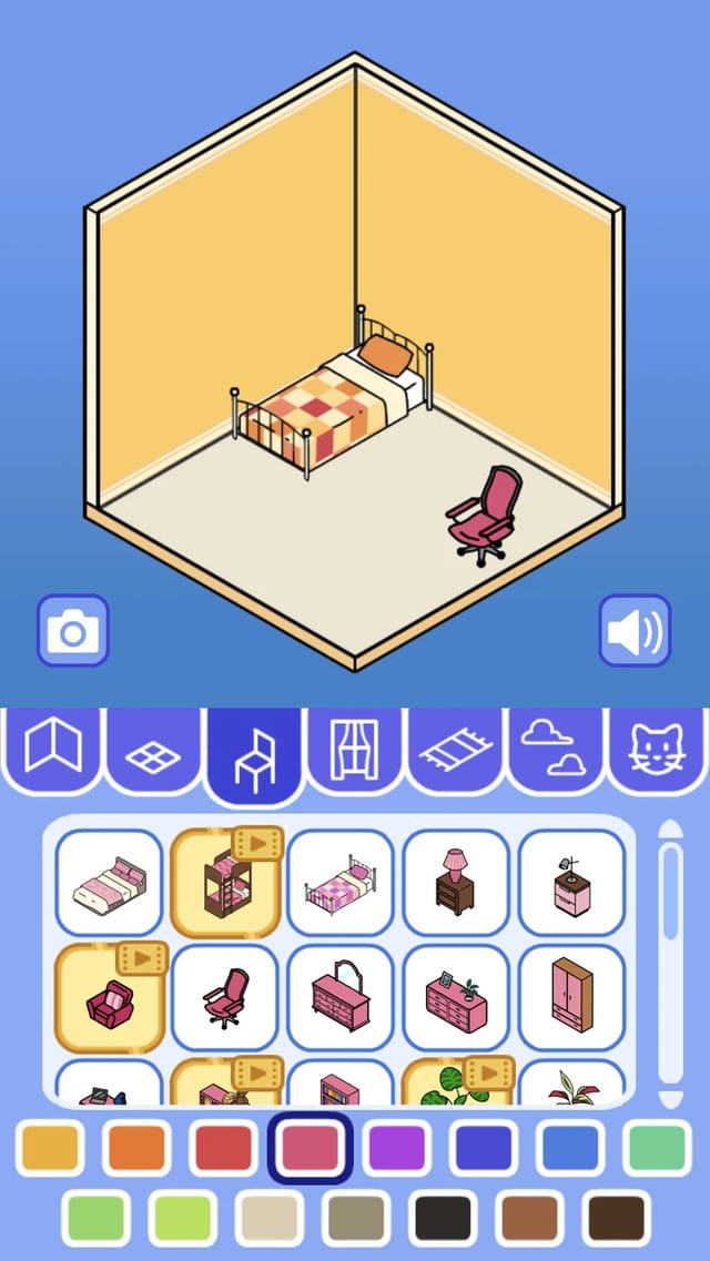 Room Design gameplay showing a checkered bed placed against the wall and a pink office chair on the floor, with the pink swatch selected and the furniture tray previews tinted pink