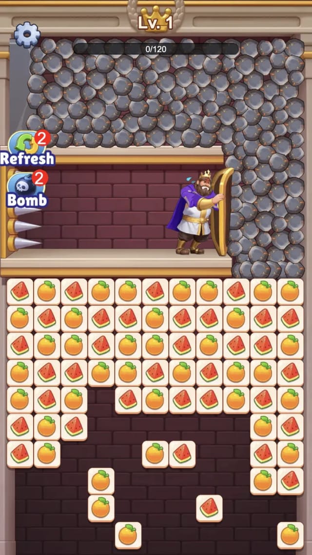 Royal Tile Rescue level 1 mid-game: fruit tiles part-cleared with leftover tiles falling, the stone pile looming above, the zero of 120 score bar and Refresh and Bomb buttons