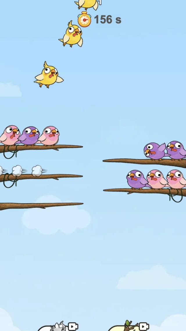 Sort Birds board seconds after a move, four yellow birds flying up to their nest while two emptied branches sit cleared below