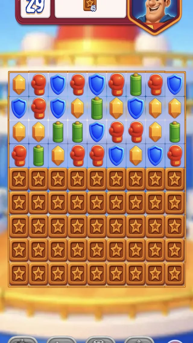 Superhero Match level 1 board right after a verified gem swap: the move counter reads 29 above a grid of glove, shield, battery and bolt gems stacked over 45 wooden crates